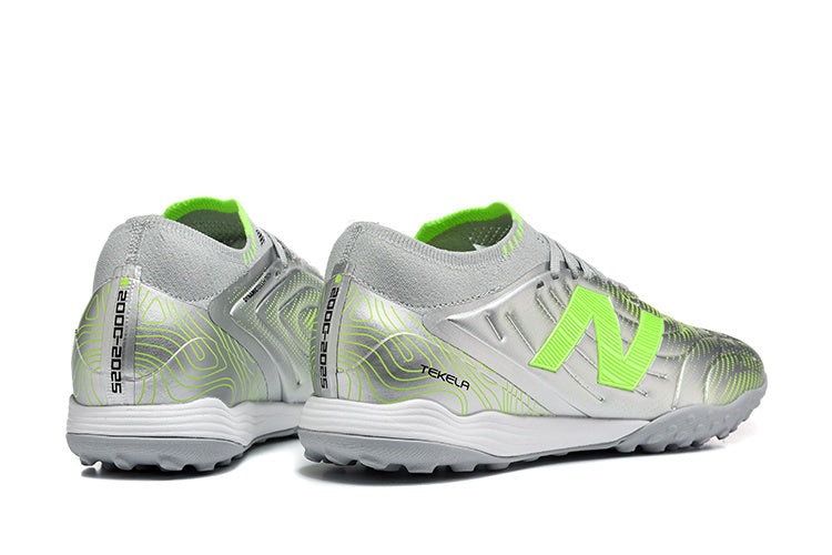 Chuteira Society New Balance Tekela Pro Low Laced FG V4+ - Cinza e Verde
