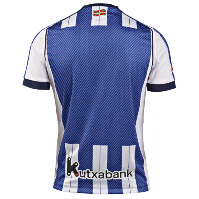 Real Sociedad Home 25/26 Torcedor Macron  - Azul e Branco